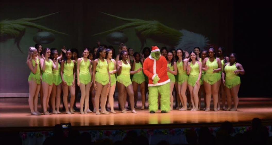 GRINCHING IT UP  Dragonettes appear on stage with the Grinch at the Christmas Show.  Photo courtesy of Andi Howell